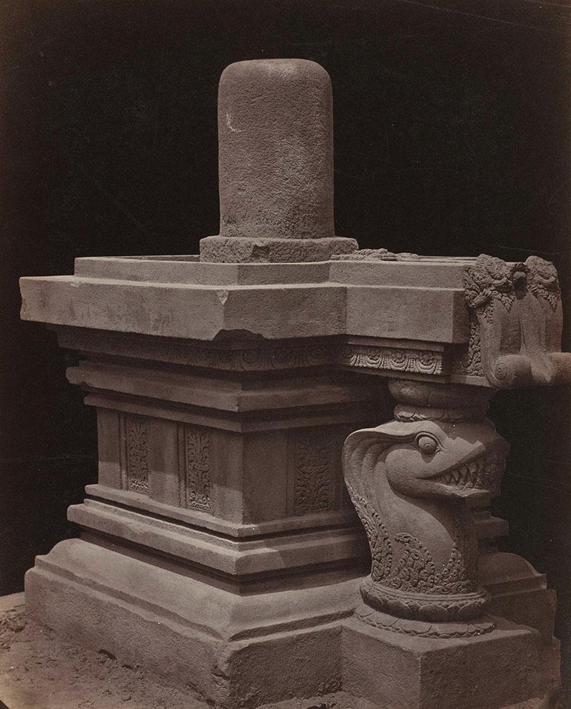 Historic stone Shiva Lingam and base with carved serpent form